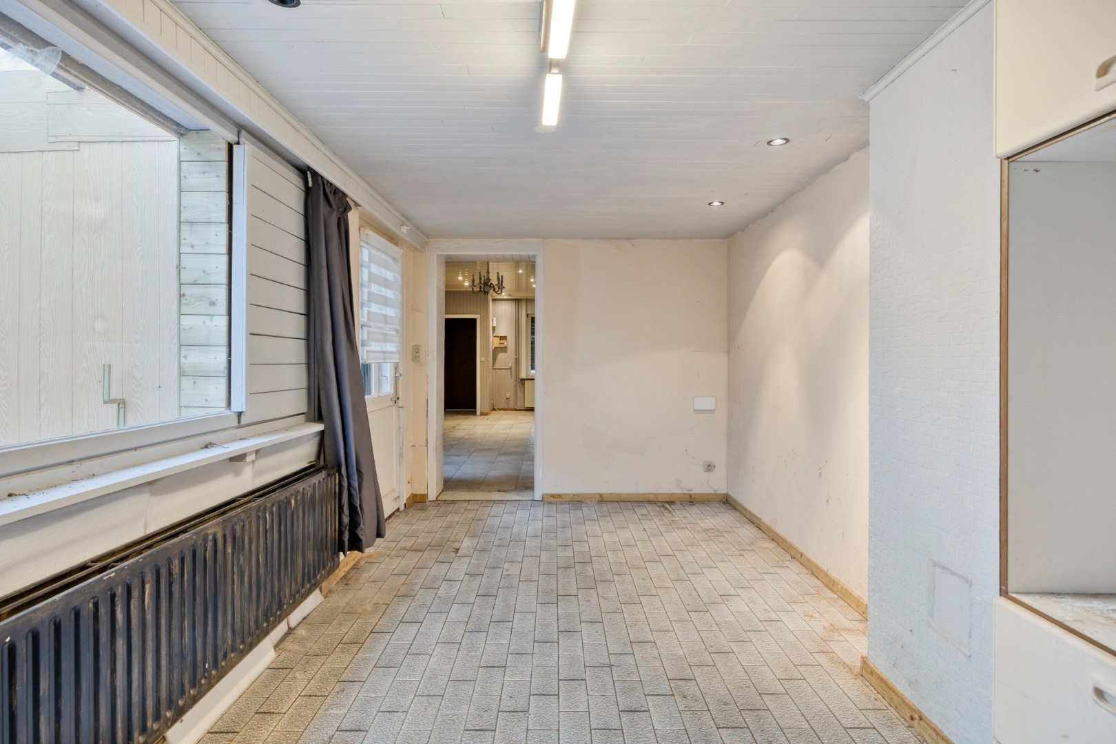 Te renoveren woning met 4 slpk. en gezellige stadstuin op een centrale ligging in Geel 