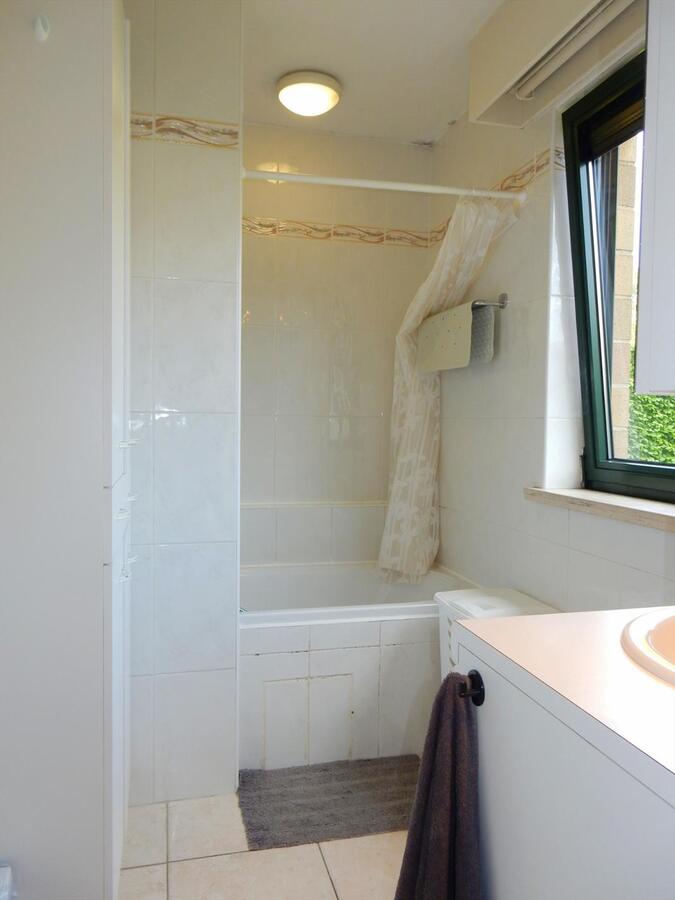 Gezellig gelijkvloersappartement met zonnige tuin en garage 