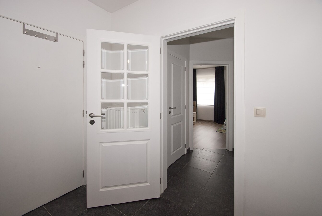 Instapklaar appartement met lift - 1 slpk, terras, 2 parkings 