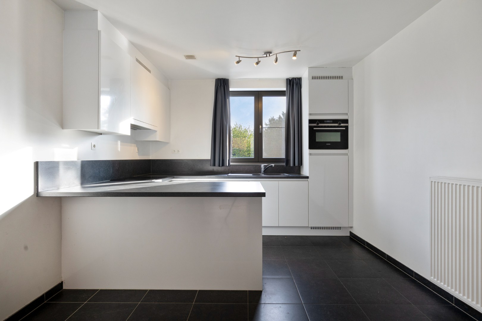 Recent appartement met 2 slaapkamers, terras, 2 ondergrondse autostaanplaatsen en private kelderberging in Herent! - EPC 41 kWh/m² - bewoonbare opp. 86 m² 