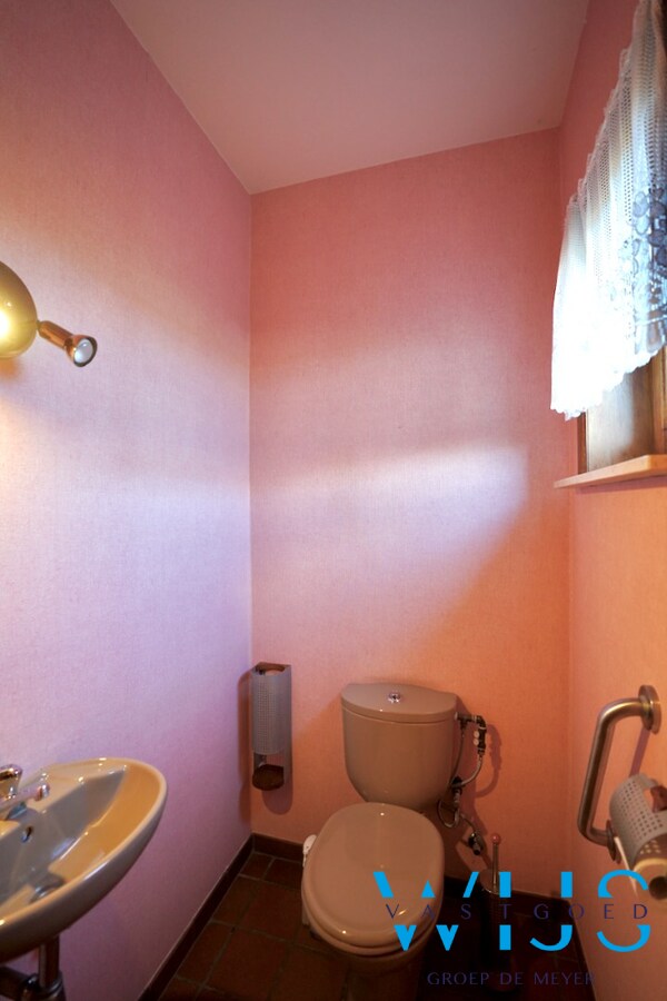 Fantastische open bebouwing met dubbele garage in gegeerde woonwijk te Evergem 