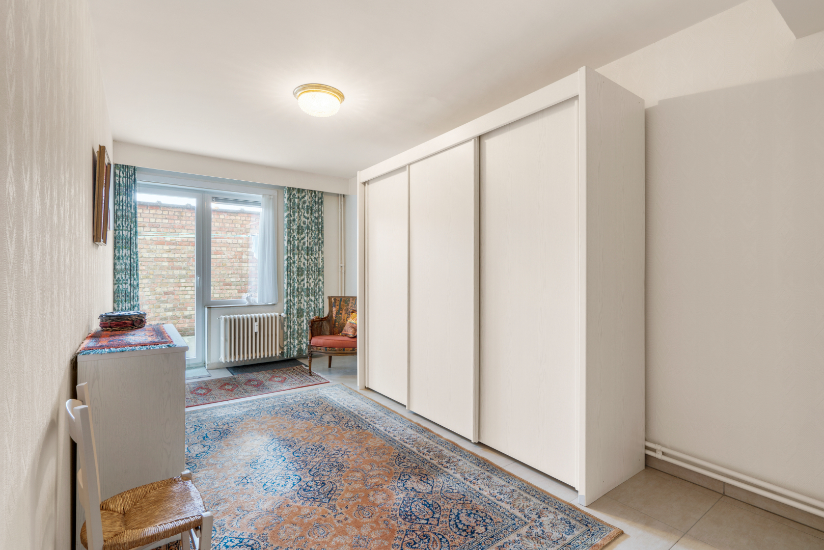 OPBRENGSTEIGENDOM MET 7 APPARTEMENTEN EN 7 GARAGEBOXEN 