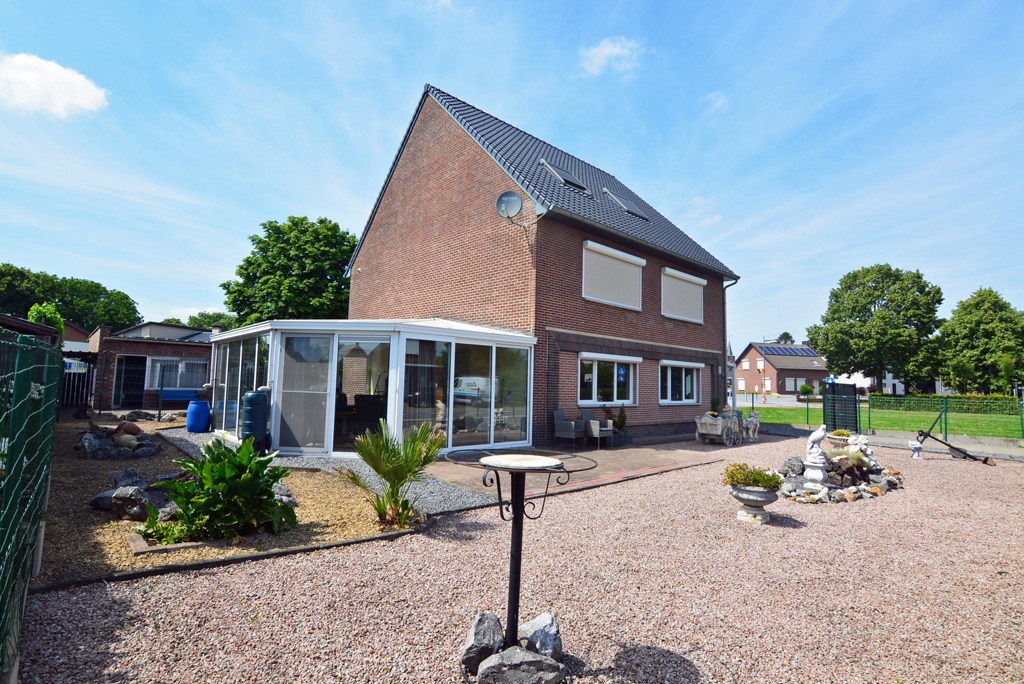 Gelijkvloers appartement met 3 slpks, veranda, tuin en garage 
