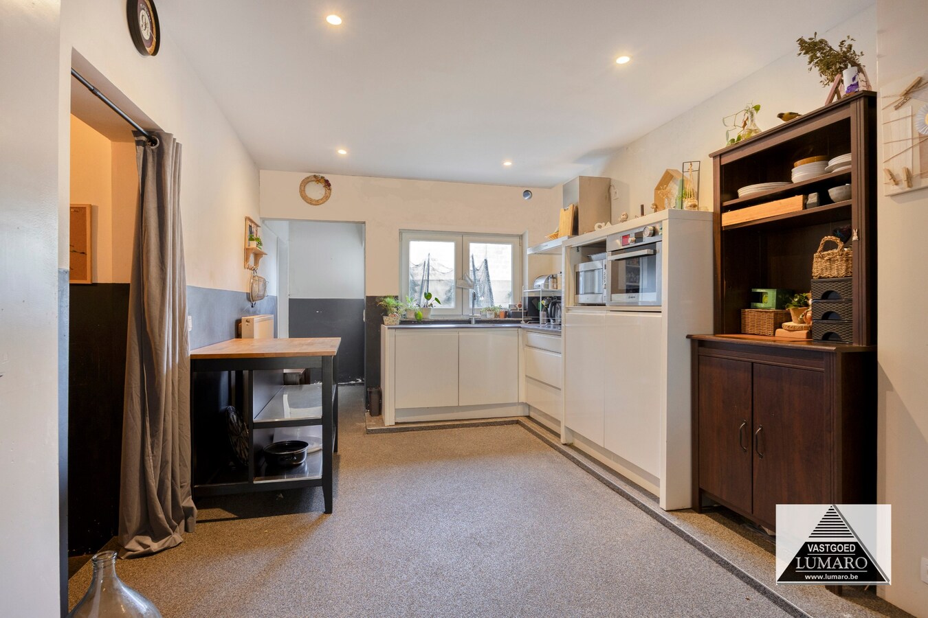 Ideale praktijk- of kangoeroewoning met tuintje en parking 