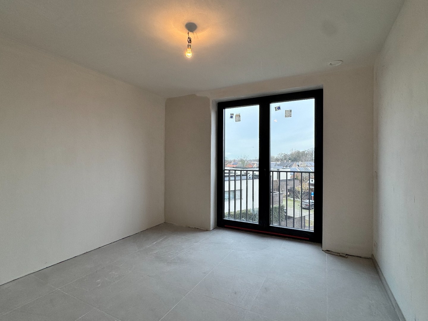 Nieuwbouwappartement met twee slaapkamers, terras en ondergrondse autostaanplaats te koop in Zulte 