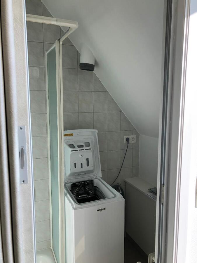 Tijdloos dakappartement met bijzonder ruim terras in centrum Gavere 