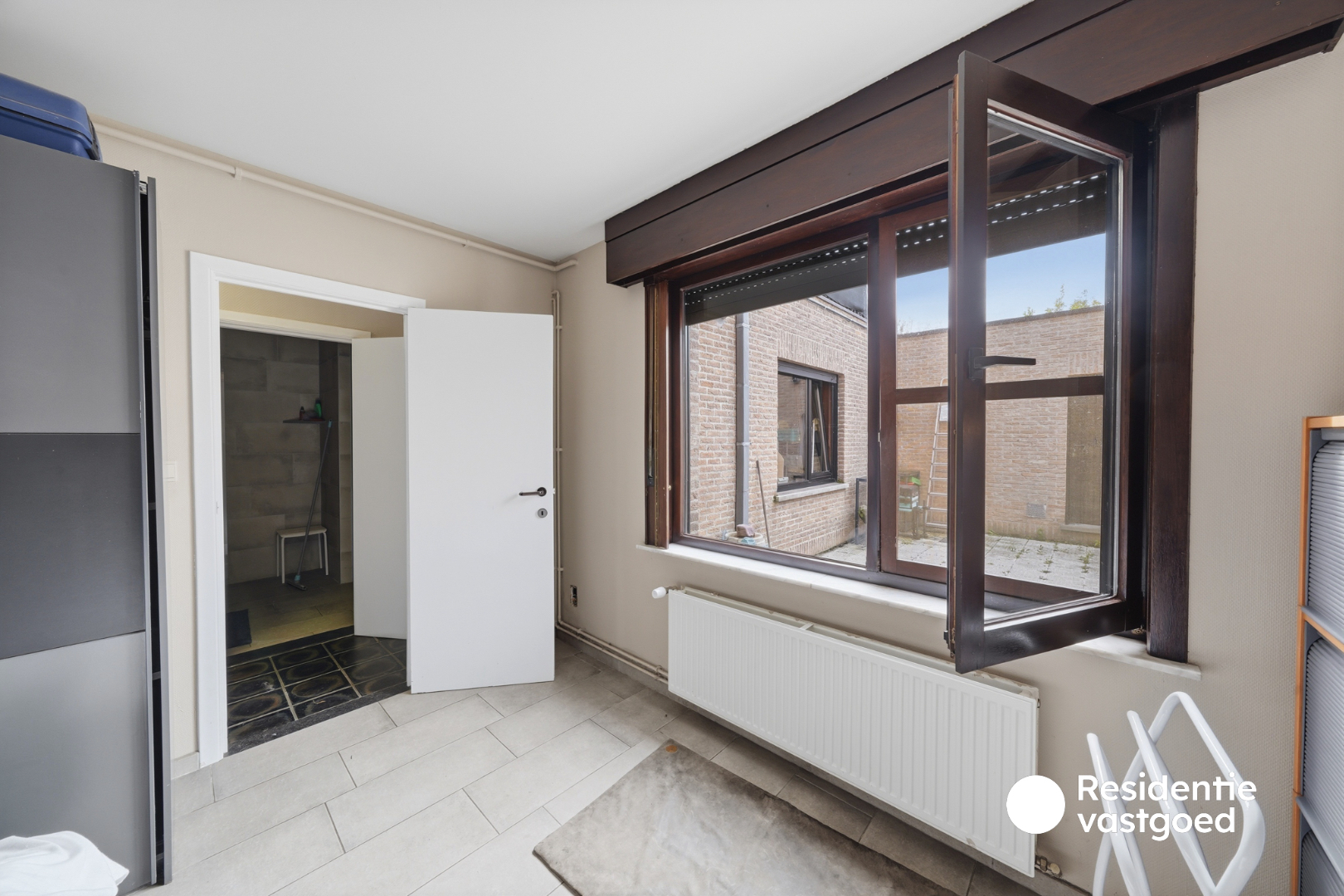 Opbrengsteigendom met 3 appartementen, garage en zonnig terras 