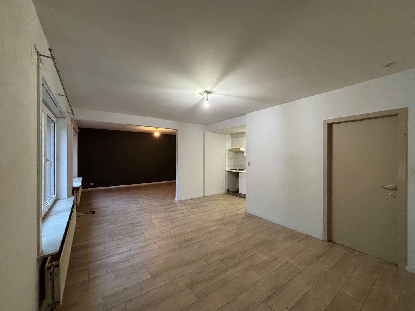 Opbrengsteigendom met 7 appartementen &amp; ruim handelspand in Mol-centrum 