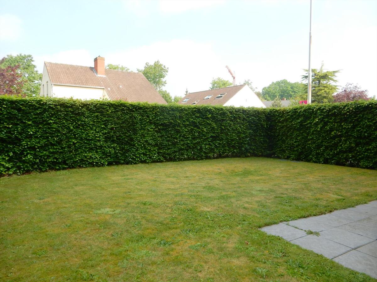Gezellig gelijkvloersappartement met zonnige tuin en garage 