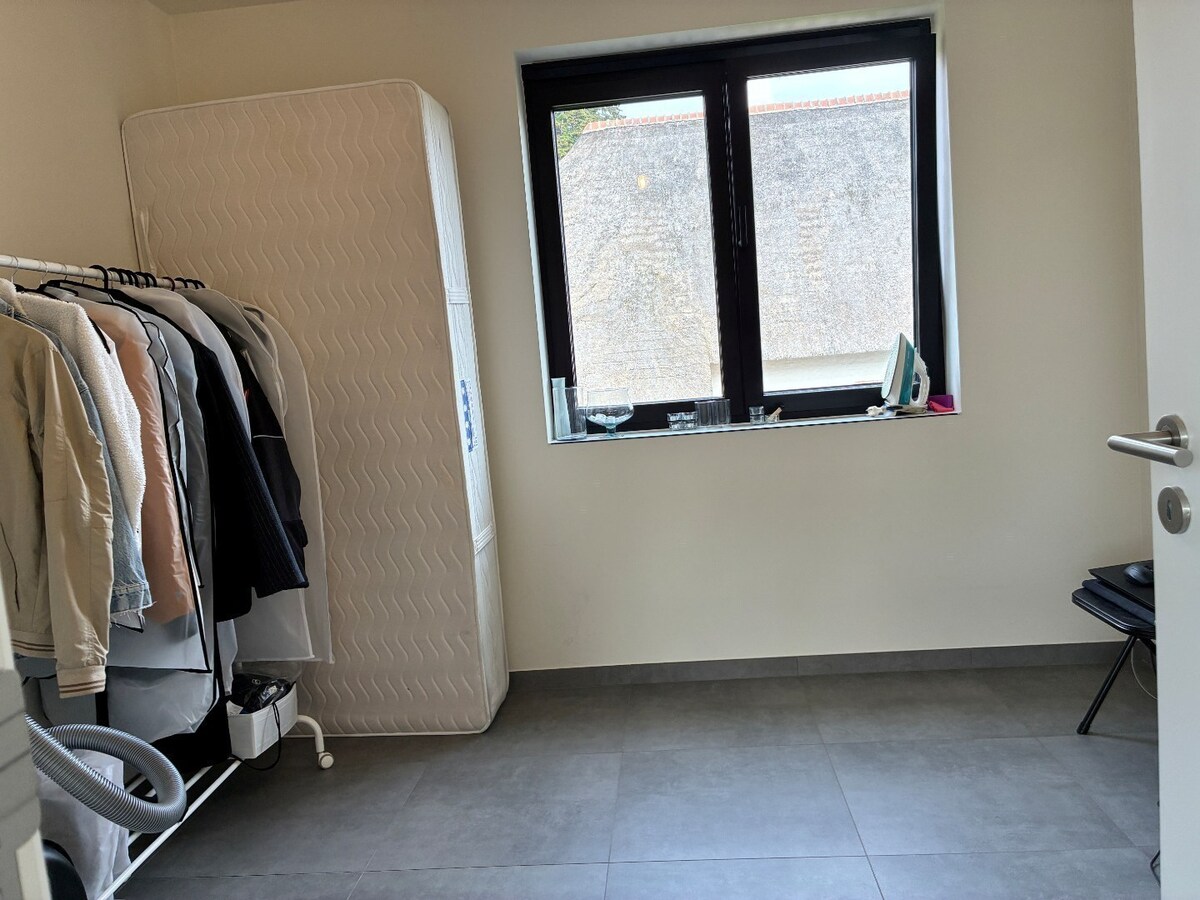 Nieuwbouwwoning op 50m van tramhalte - met terras en tuin ! 