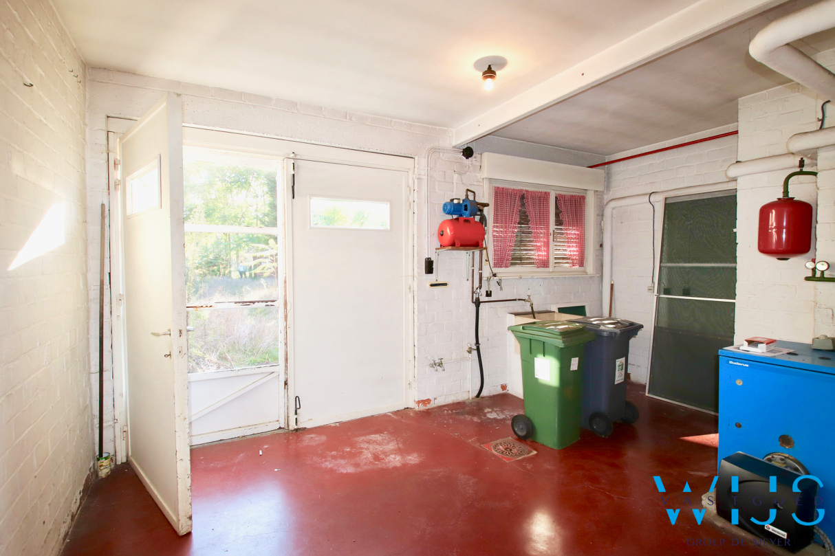 Te renoveren gezinswoning op een zonnig perceel van 1184m² te Wachtebeke ! 