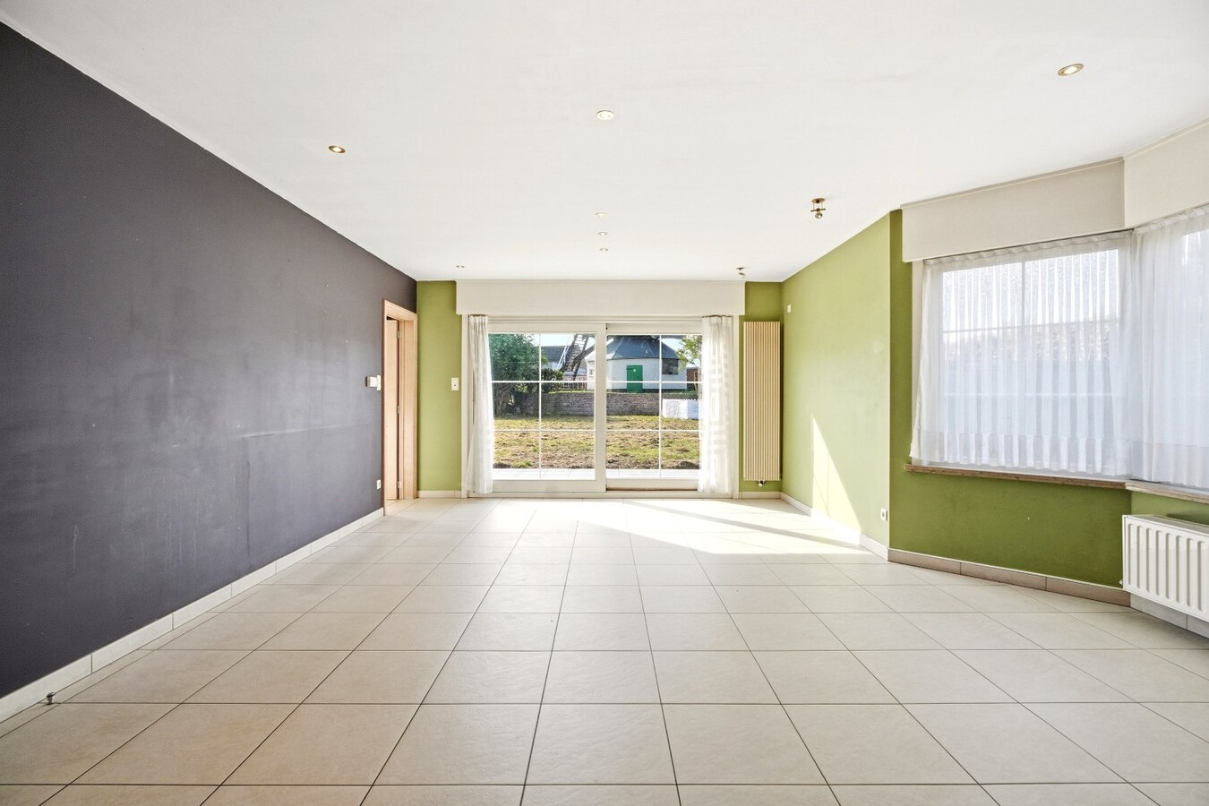 Ruime halfopen woning met 5 slaapkamers te koop in Werken met garage en ruime tuin! 