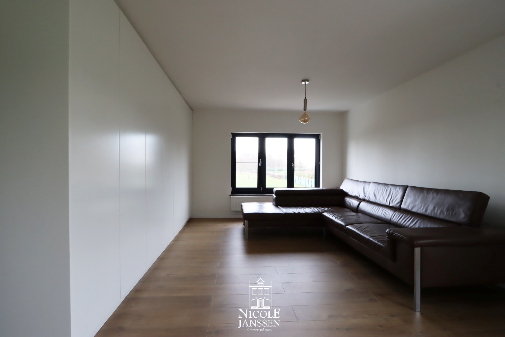 Ouderlijke slaapkamer met zithoek 