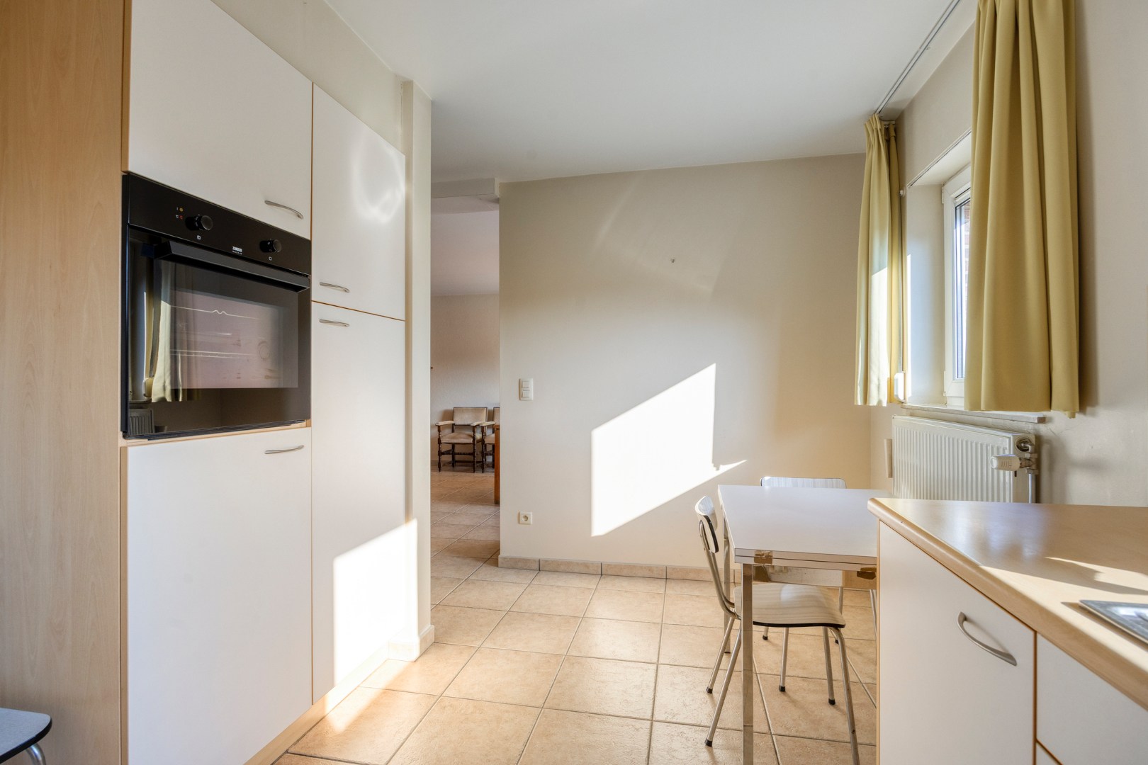 Gelijkvloers appartement met 3 slpk., ruim terras en ondergrondse garagebox in hartje Leopoldsburg 