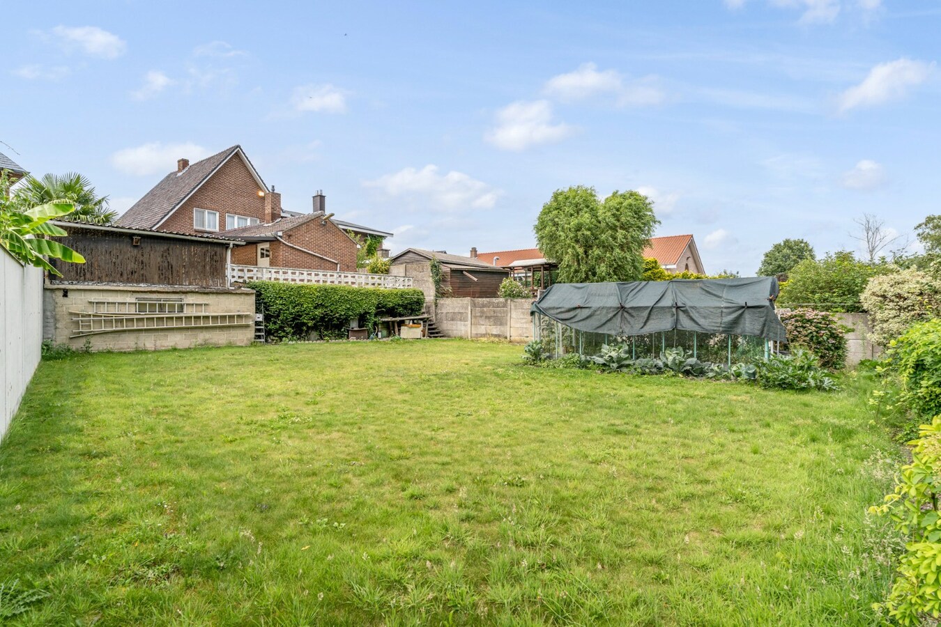 Halfvrijstaande gezinswoning op een ruim perceel van 13a80ca op wandelafstand van het centrum van Opoeteren! 
