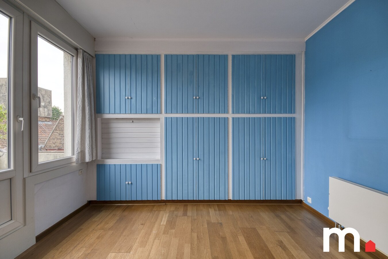 Centraal gelegen woning met privé parkeerplaats te koop in Heule ! 