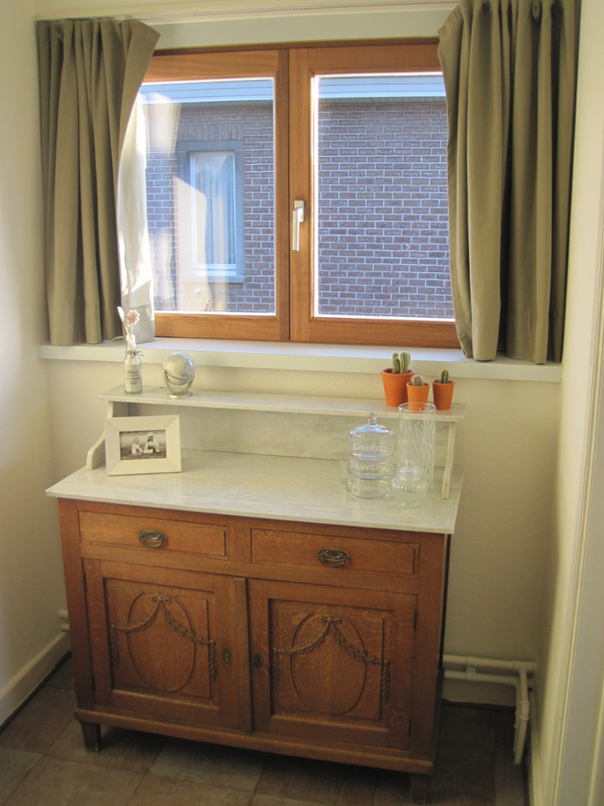 Degelijke én gezellige woning. Met tuin en met garage. 