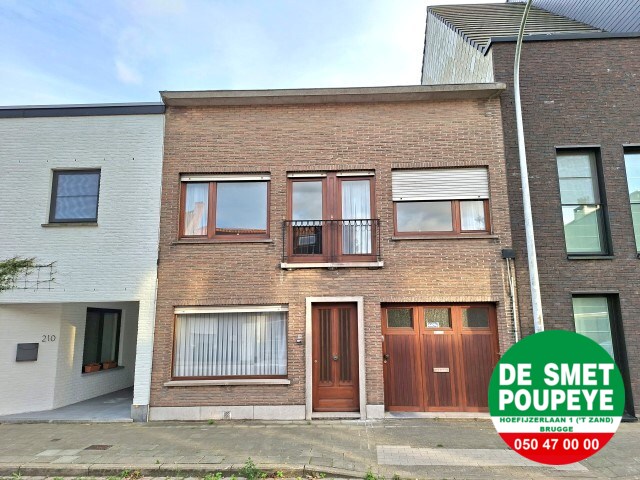 Ruime rijwoning met garage en tuin 