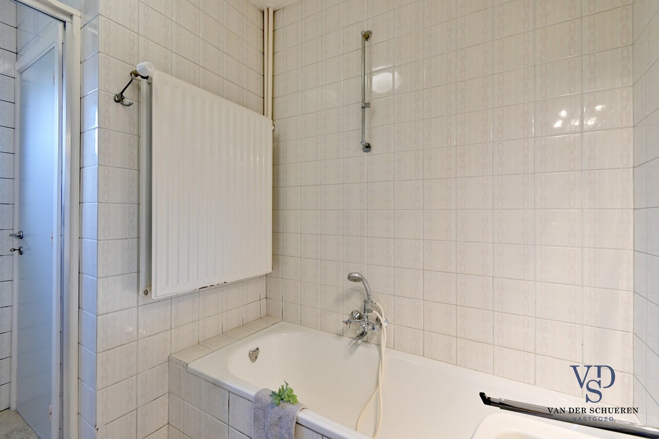 Half Open gezinswoning met potentieel 