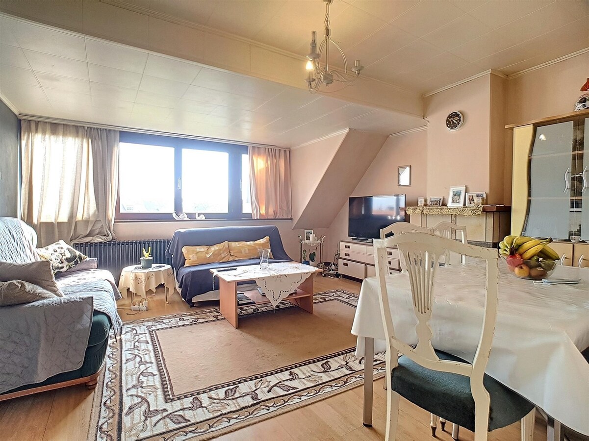 Dakppartement aan het marktplein te Heist 