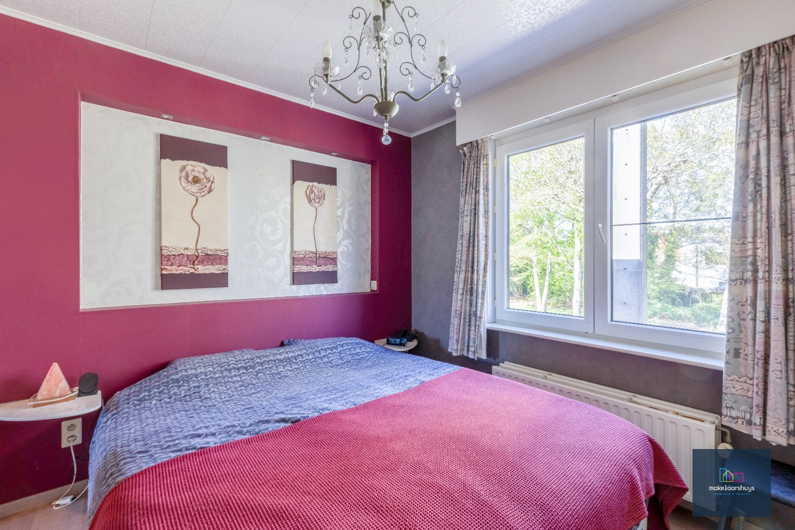 Goed onderhouden en ruime woning in rij met tuin/terras te Wondelgem 