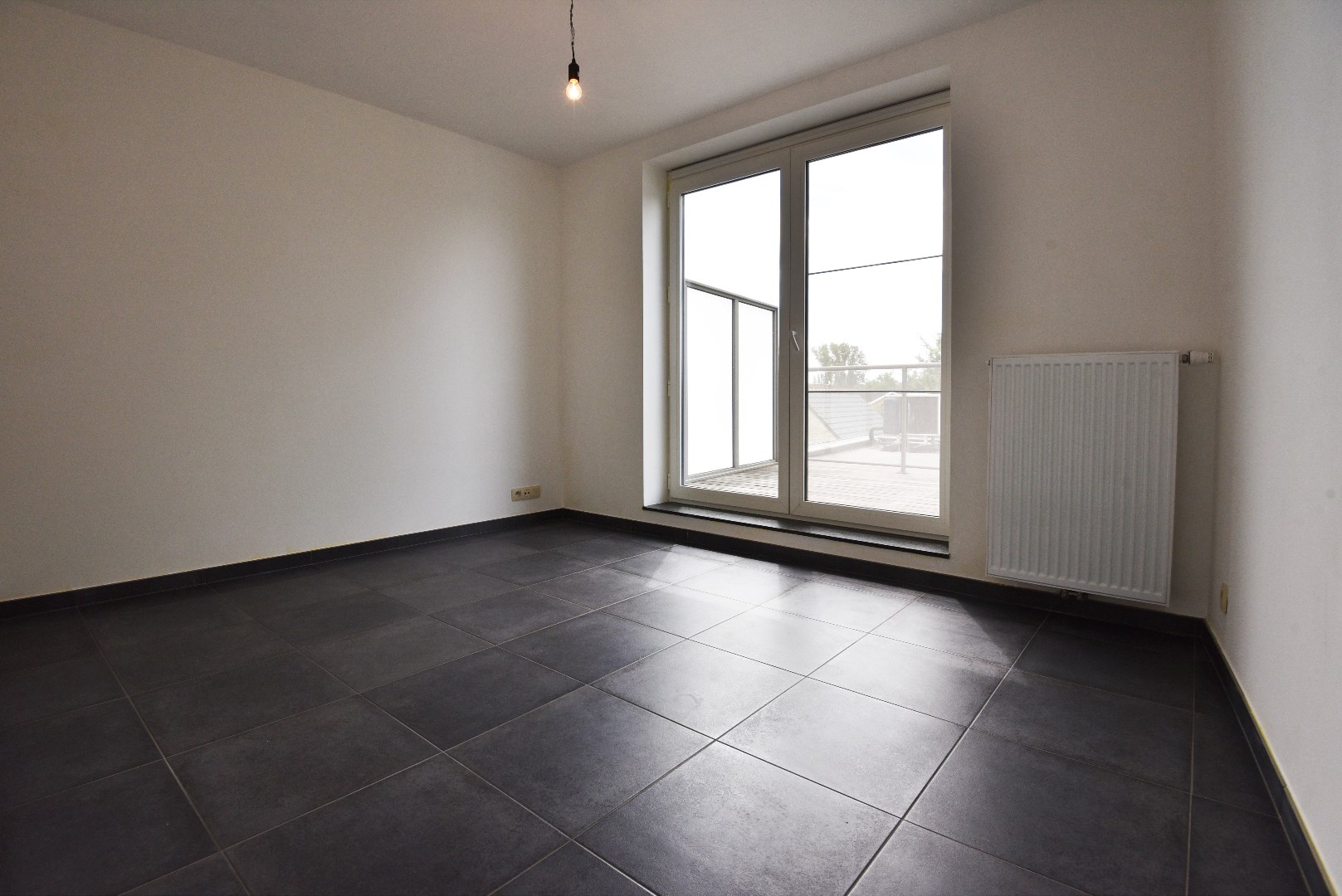 Centraal gelegen app met 1 slk, 2 terrassen en autostaanplaats te ADEGEM . 