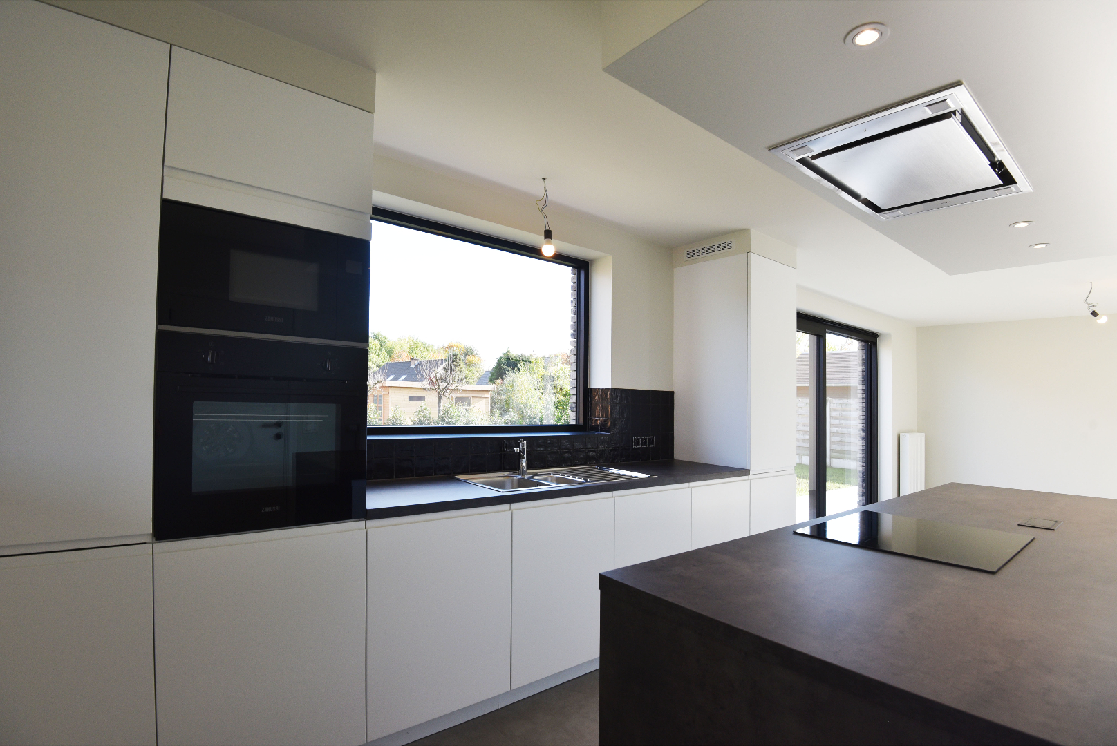 NIEUWBOUW open bebouwing (BEN-woning) met 3 slpks, carport, tuinhuis en tuin te Adegem 