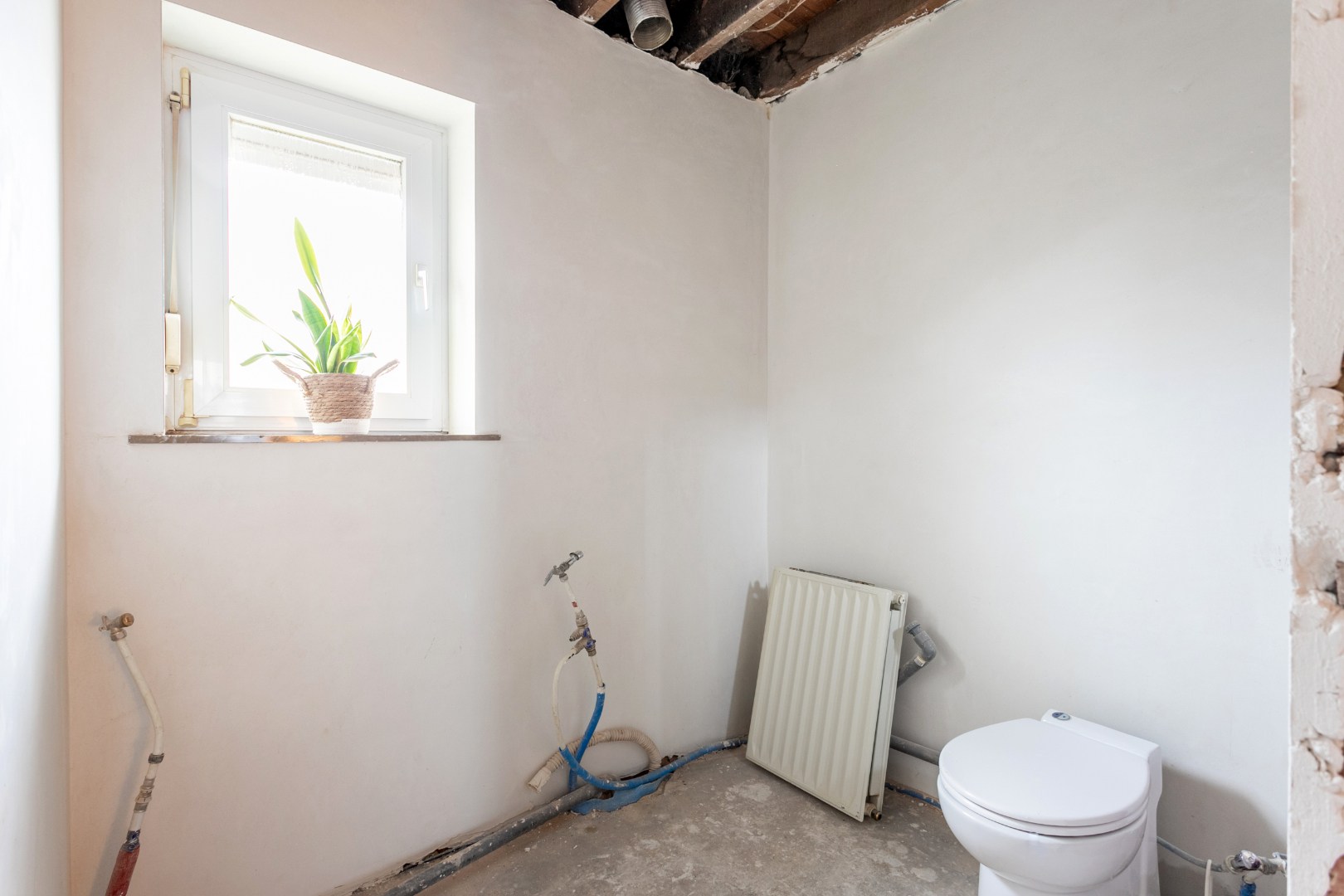 Rustig gelegen halfopen woning met 3 slpks en tuin te Buizingen 