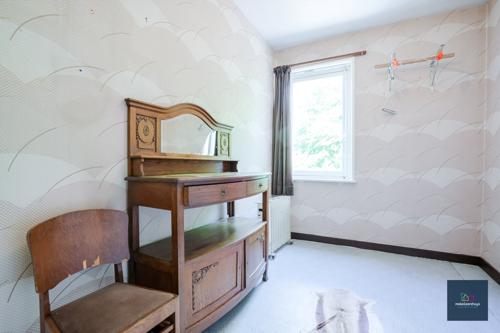 Centraal gelegen te renoveren woning in rij met tuin te Mariakerke 