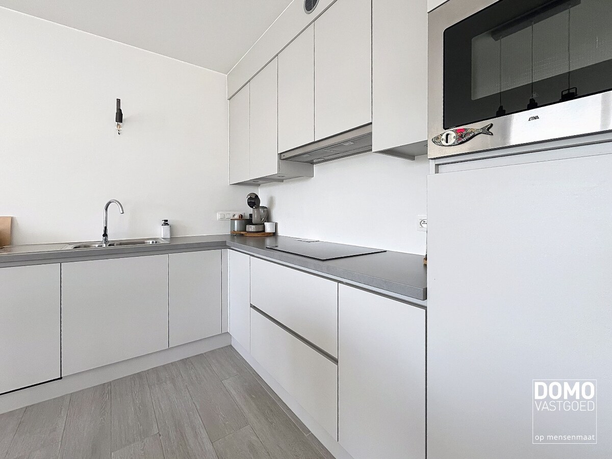 INSTAPKLAAR TWEE SLAAPKAMER APPARTEMENT MET TERRAS RUSTIG GELEGEN TE BOEKT (HEUSDEN-ZOLDER) 