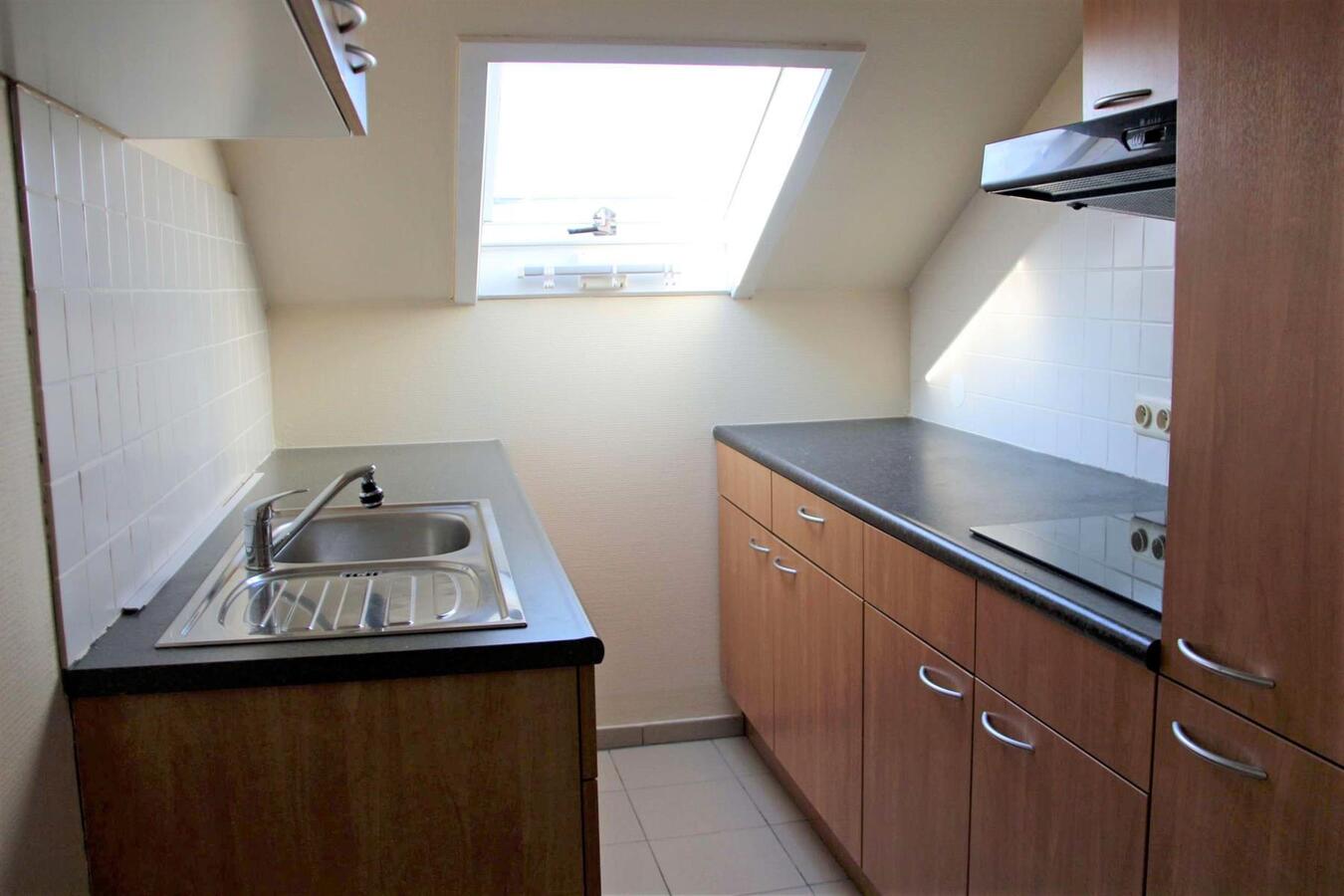 Instapklaar dakappartement met garagebox in Kuringen 