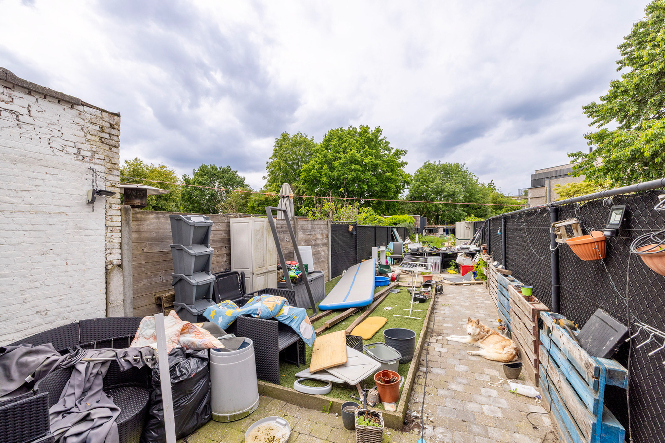 Stadswoning - 3/4 slpks - tuin - uitweg achteraan 