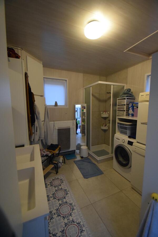 Ruime halfopen 3-slaapkamer-woning met garage en tuin 