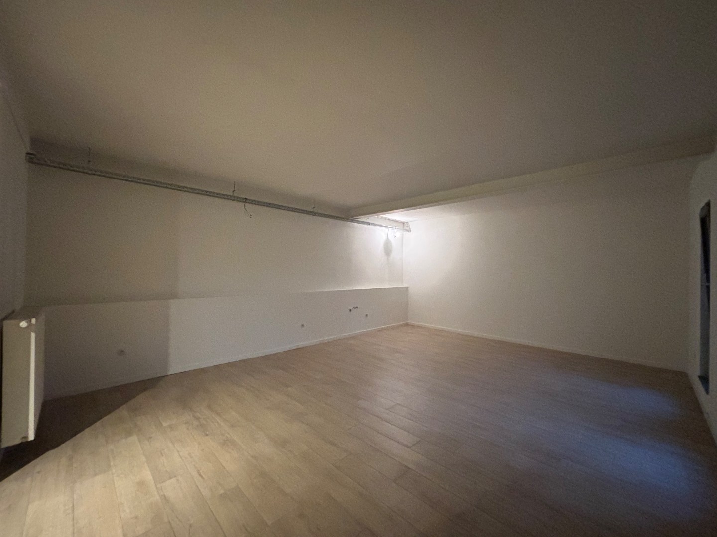 Opbrengsteigendom met 7 appartementen &amp; ruim handelspand in Mol-centrum 