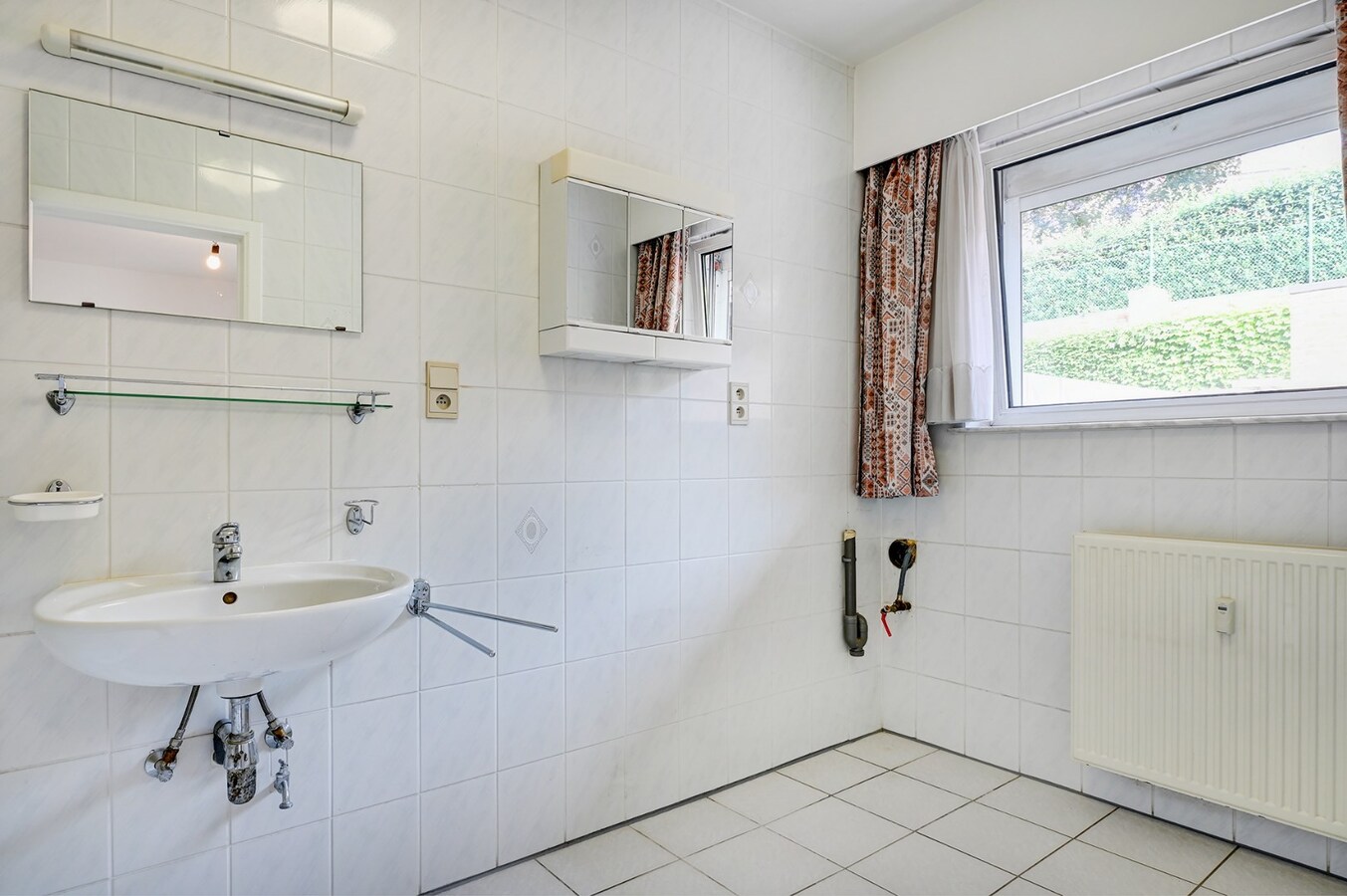 Centraal gelegen appartement met ondergrondse garage en groot terras 