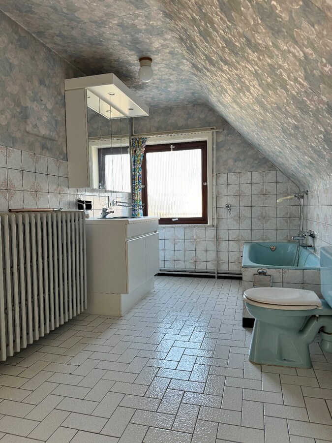 Alleenstaande woning met 4 slaapkamers en garage te Westende 