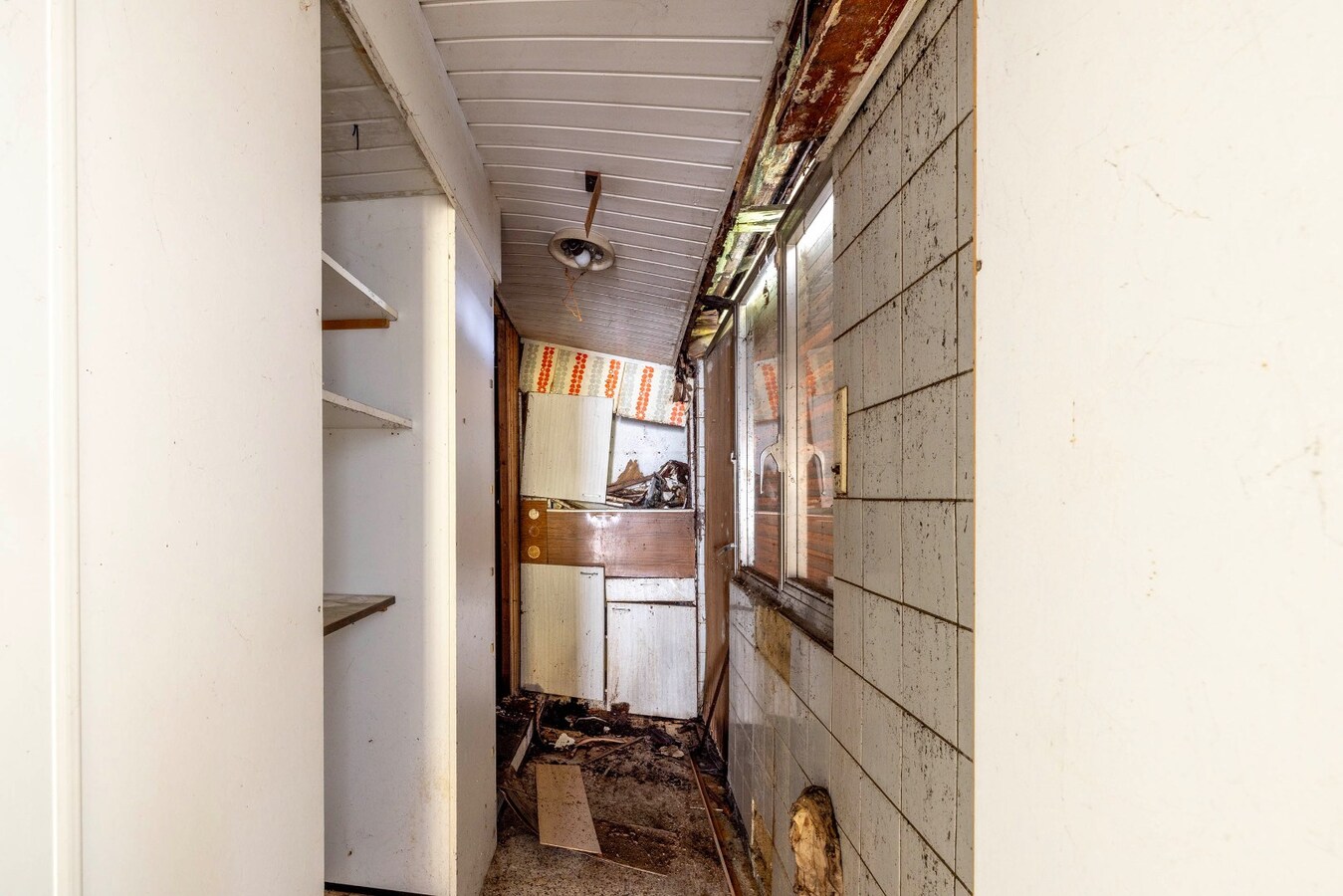 Te renoveren woning met 2 slpk en stadstuin 