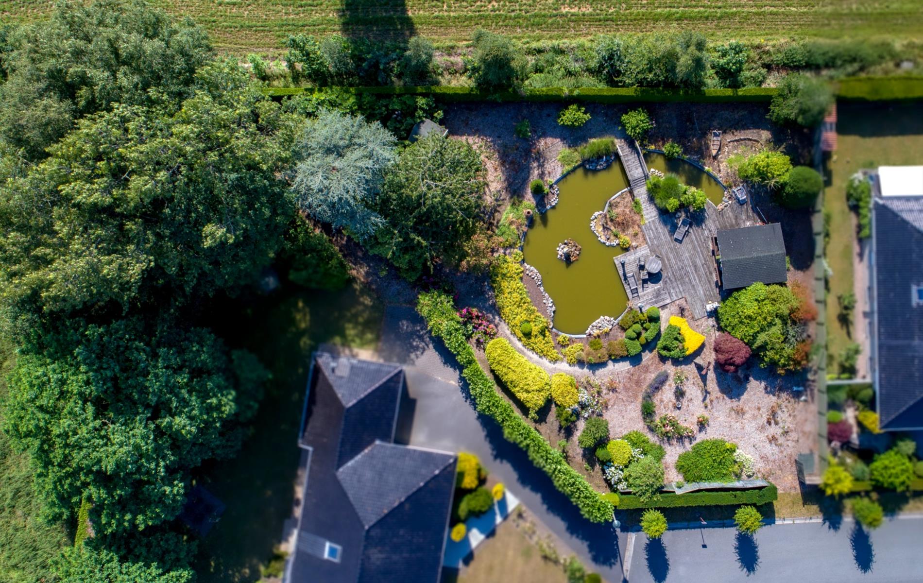 Westelijk georiënteerd lot bouwgrond 1.223m² in residentiële "bloemenwijk" te Maldegem 