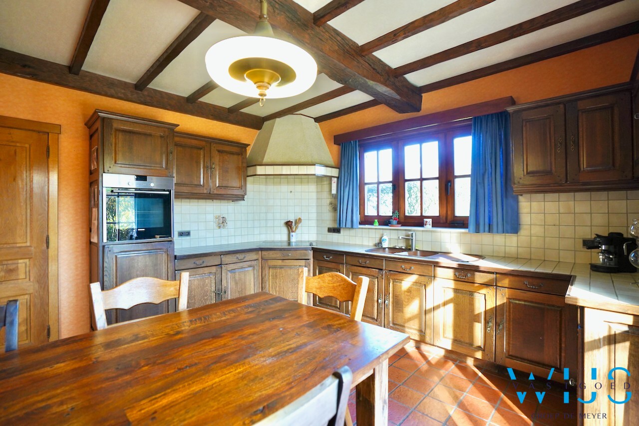 Fantastische open bebouwing met dubbele garage in gegeerde woonwijk te Evergem 