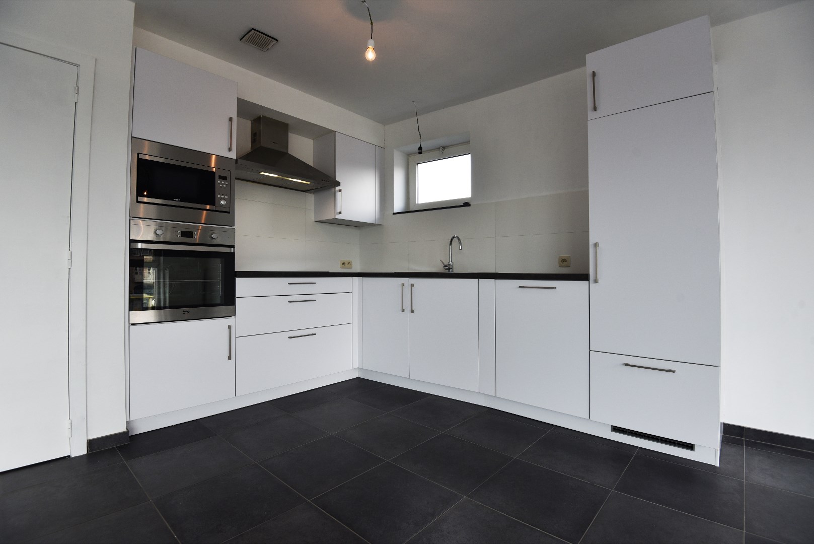 Centraal gelegen app met 1 slk, 2 terrassen en autostaanplaats te ADEGEM . 