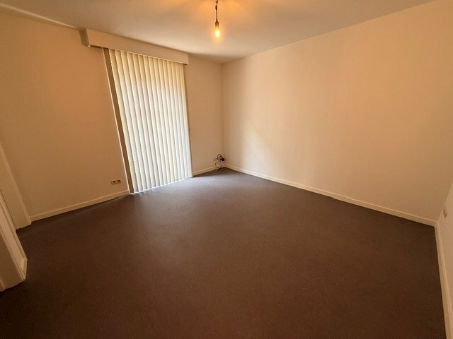 Verzorgd appartement met 1 slaapkamer, terras en lift in het centrum van Maaseik. 