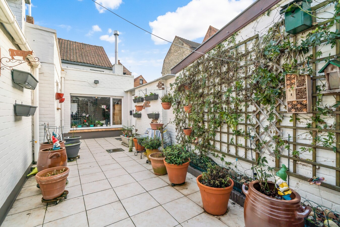 Halfopen bebouwing met terras in Christus - Koning (Stubbekwartier) 