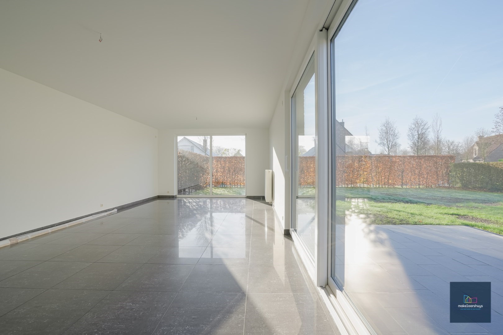 Ruime half-open bebouwing te Heusden met garage en tuin 