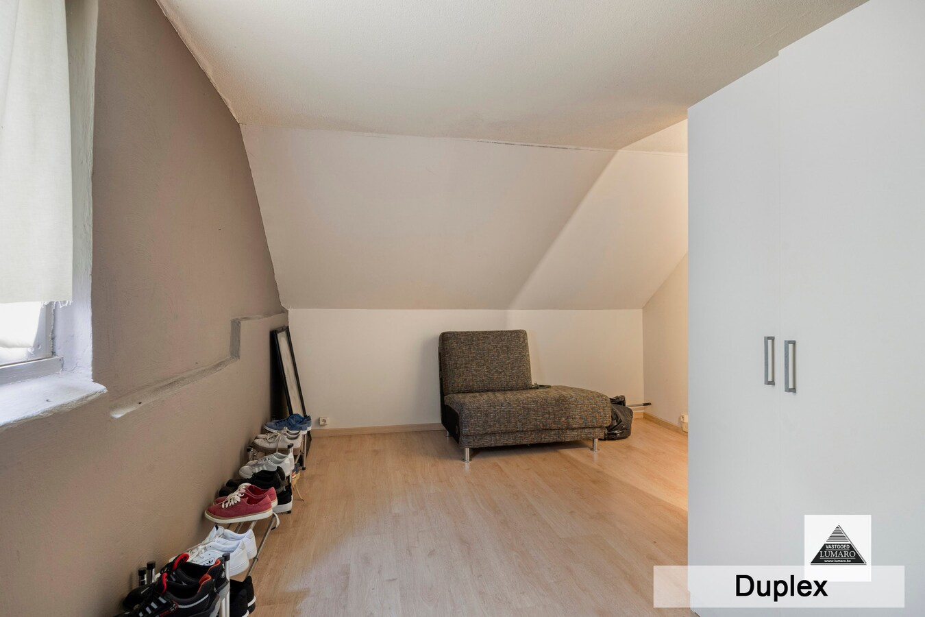 Dilsen-centrum - opbrengstpand: winkel + 2 appartementen 