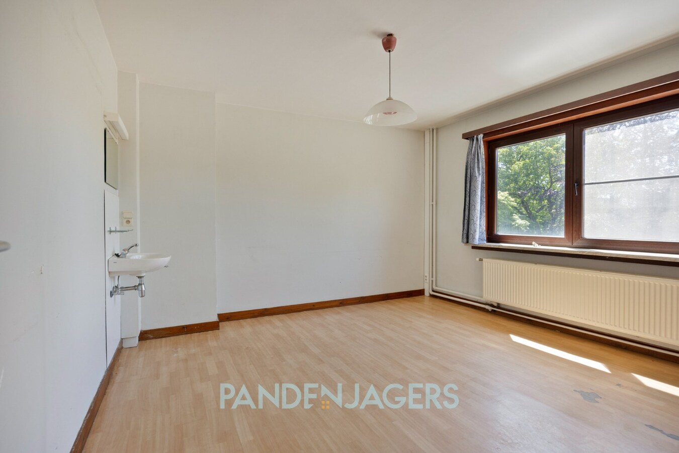 Rijwoning met diepe tuin en extra ingang voor de tuin te Duffel 