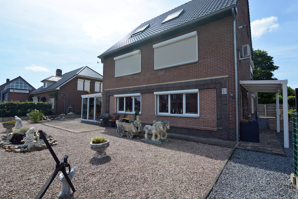 Gelijkvloers appartement met 3 slpks, veranda, tuin en garage 