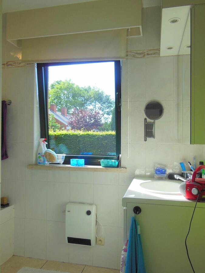 Gezellig gelijkvloersappartement met zonnige tuin en garage 