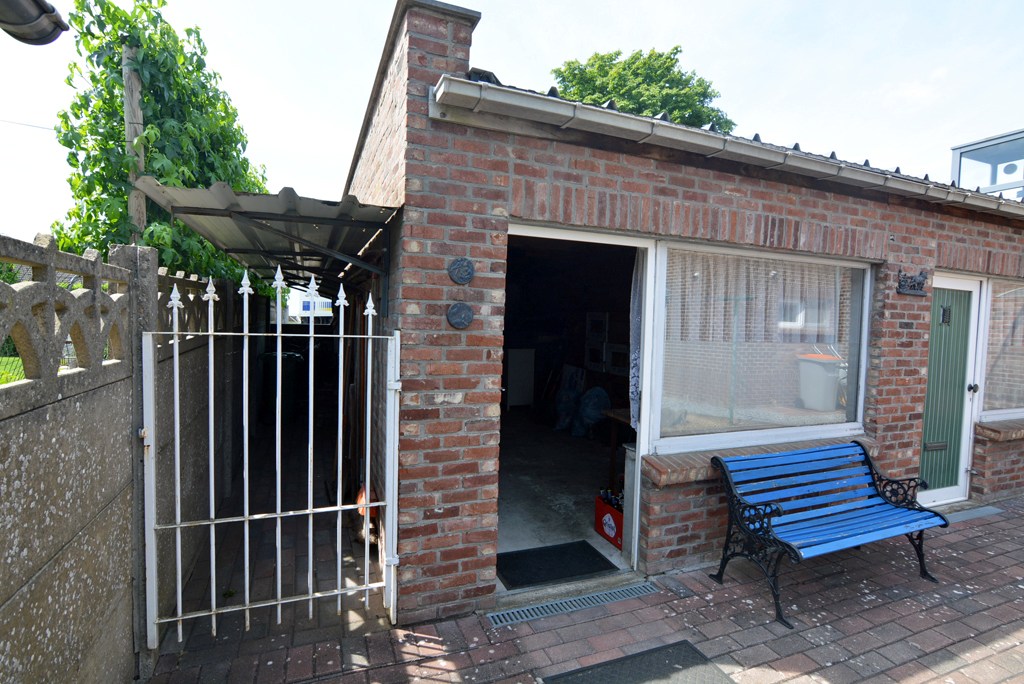 Gelijkvloers appartement met 3 slpks, veranda, tuin en garage 