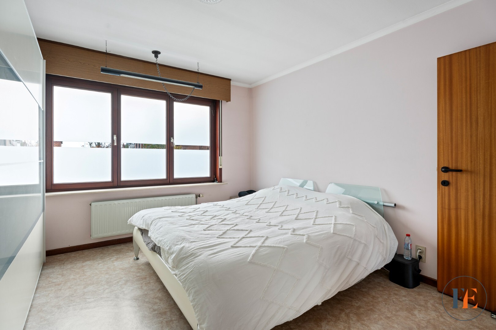 Huis met inpandige garage, tuin en  atelier te Wondelgem 