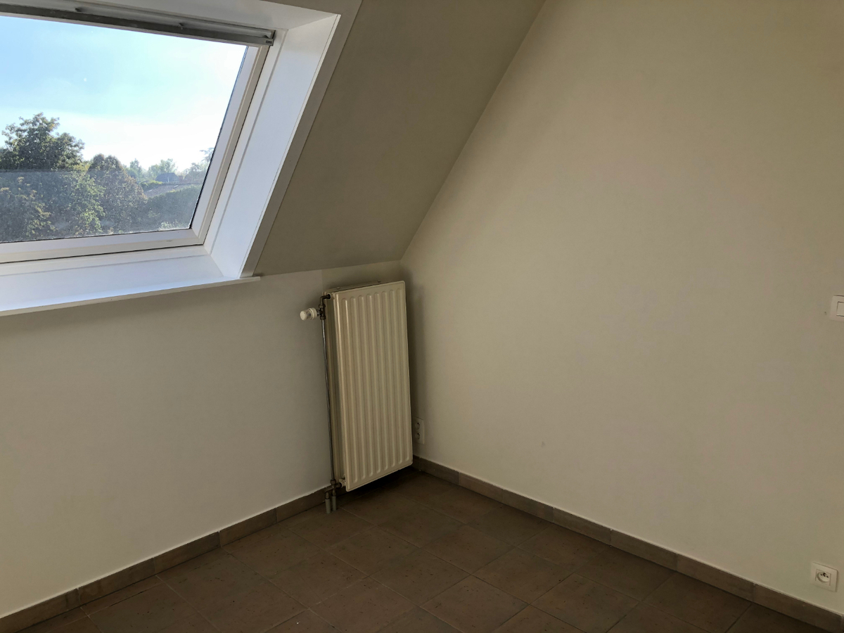 Tijdloos dakappartement met bijzonder ruim terras in centrum Gavere 